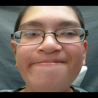 Implant retained prosthesis fitting over microtic remnant 